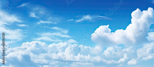 Panoramic view of a bright blue sky with beautiful clouds providing an ideal copy space image