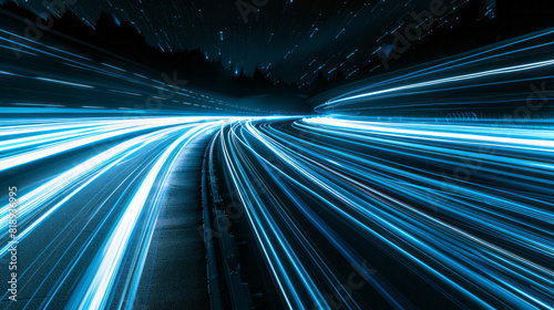 A streak of dynamic blue light trails across a pitch-black background, creating a sense of speed and fluid motion. The light bends and curves gracefully, symbolizing velocity and futuristic technology