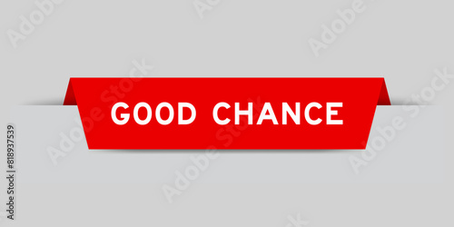 Red color inserted label with word good chance on gray background