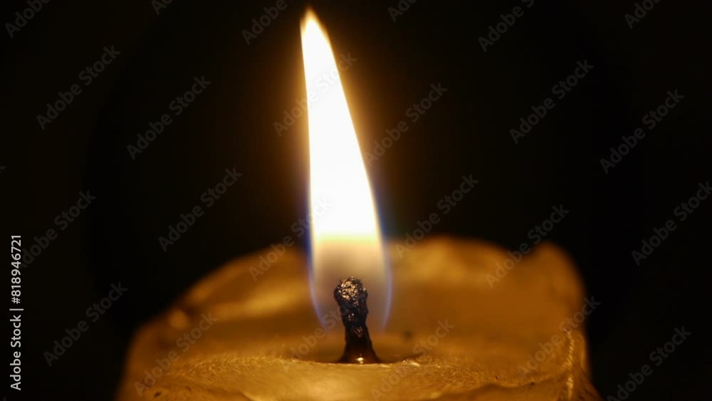burning candle in the dark