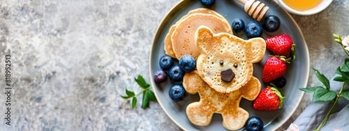 baby pancakes with honey and berries. Selective focus