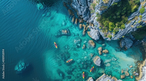 Fototapeta Naklejka Na Ścianę i Meble -  Drone view on rocks and canoes floating on turquoise water in the Halong Bay, Vietnam 