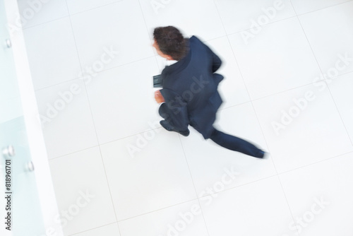 Office, work and floor with motion blur of businessman for legal, career and running late to job. High angle, corporate and attorney with speed in movement for schedule, deadline and rush in lobby