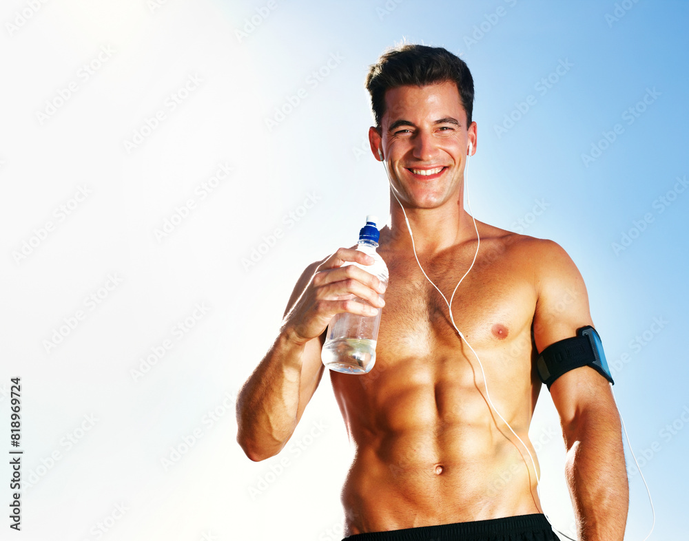 Water, tired and man on field for workout, earphones and portrait with bottle and summer. Training, cardio and exercise for male person or athlete, running or park for fitness with music and sunlight Water, tired and man on field for workout, earphones and portrait with bottle and summer. Training, cardio and exercise for male person or athlete, running or park for fitness with music and sunlight