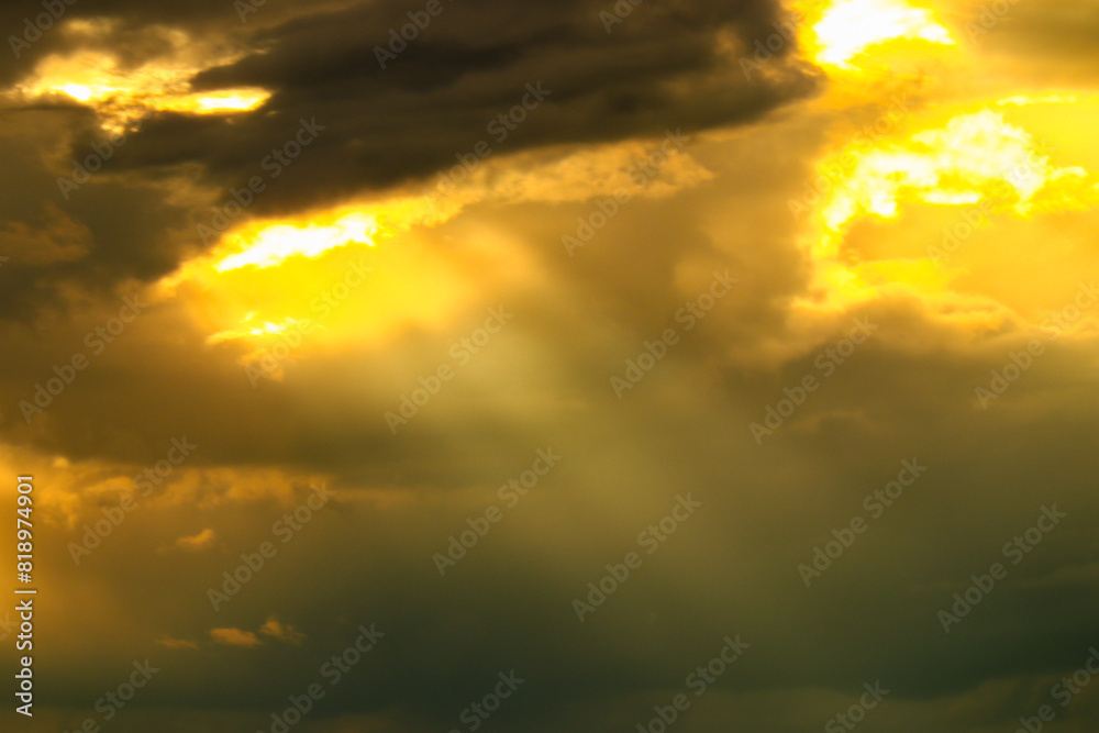 Fototapeta premium sun rays and clouds with sunset colors