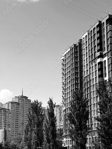 Tall office building against the sky in black and white