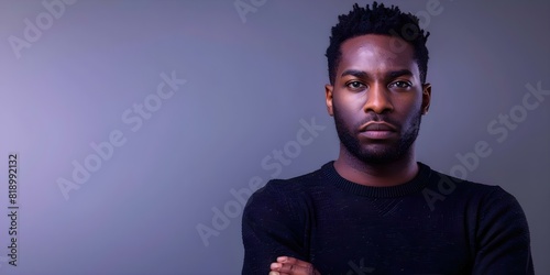 African man in black sweater on pastel background explores anger management. Concept Portrait Photography, Emotions, Anger Management, Pastel Background, African Man photo