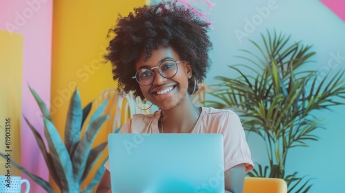 Cheerful Woman at Colorful Desk photo