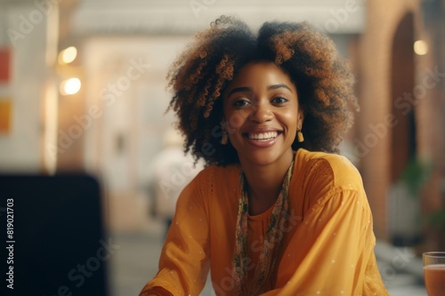 Portrait of an Afro-American Woman With a Big Smile Looking Straight Into a Camera
