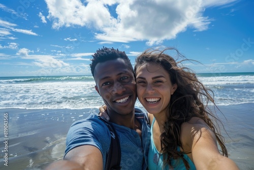 Couple taking selfie on the beach