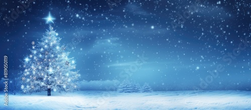 Winter background Christmas tree on snow and blue lights Christmas background with falling snowflakes copy space For a greeting or message about promotions and sales © Gular