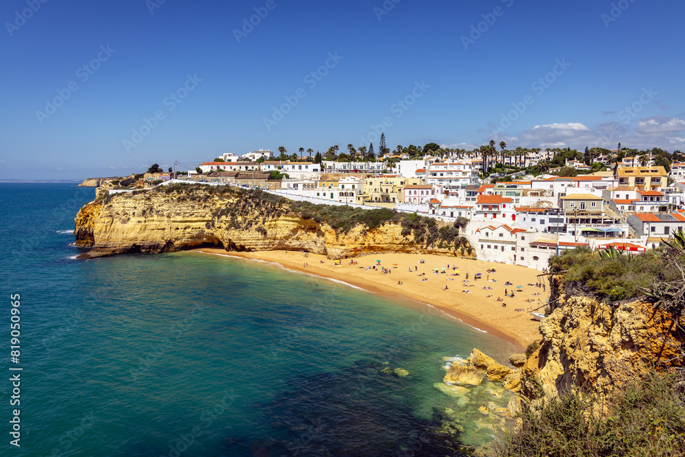 View from the sandstone sea cliffs of Carvoeiro, a picturesque and traditional Portuguese resort town in the Algarve, Portugal