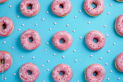 Pink donuts on blue surface photo