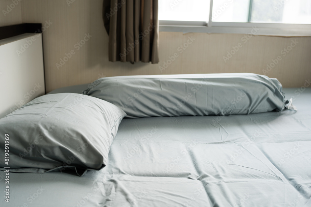 Obraz premium Closeup of simple bedroom with blue bed