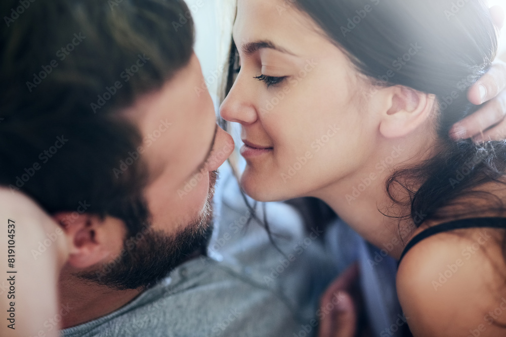 Love, affection and couple in bed with intimate romance, smile and morning bonding in apartment. Relationship, man and woman in bedroom with embrace, passion and relax with care on weekend in home
