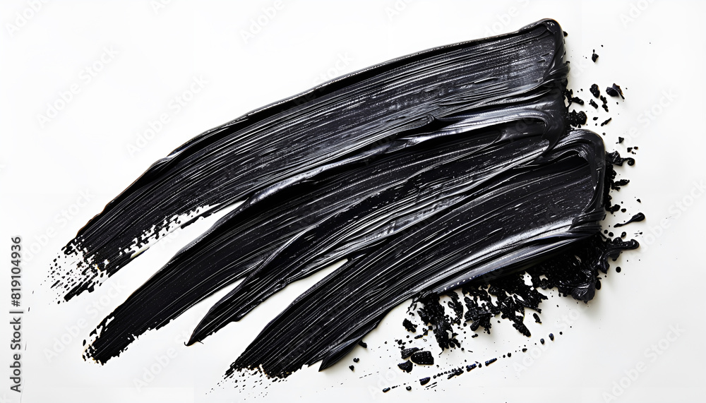 Black oil paint stroke on white background, top view Black oil paint stroke on white background, top view