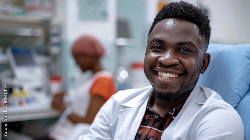 Happy African Man Sitting In The Chair In Bright Hospital And Getting His Hepatitis B Vaccine Happy African Man Sitting In The Chair In Bright Hospital And Getting His Hepatitis B Vaccine