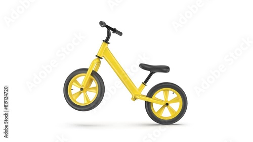 Yellow balance bike on white background