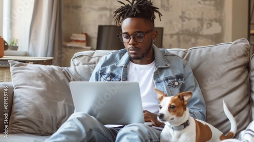 Man Working Remotely with Dog