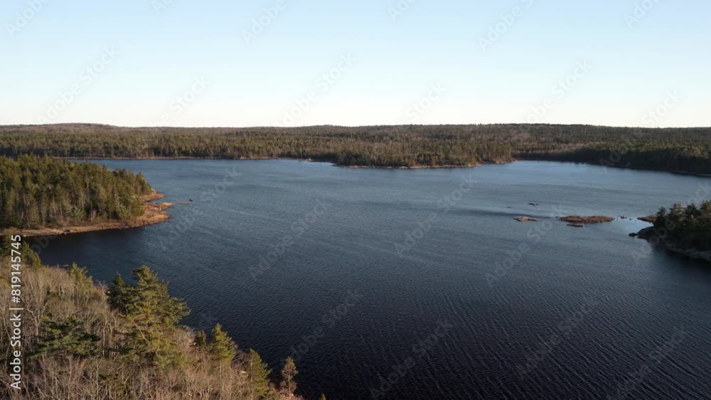 Aerial view. Amazing Canadian wildlife, wild forest and lake with islands at a beautiful sunset in Nova Scotia, Halifax. Aerial view. Amazing Canadian wildlife, wild forest and lake with islands at a beautiful sunset in Nova Scotia, Halifax.