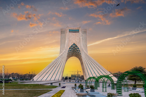 At sunset, locals enjoy a leisurely evening at this iconic landmark in Tehran, the capital of Iran. Azadi Towers, Iran. photo