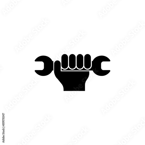 A black and white icon depicting a clenched fist holding a wrench, symbolizing manual labor or repair.