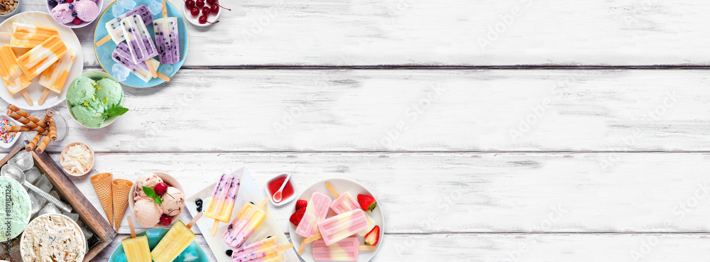 Cool summer food corner border. Assortment of refreshing ice cream, popsicle and frozen treats. Top down view on a white wood banner background.