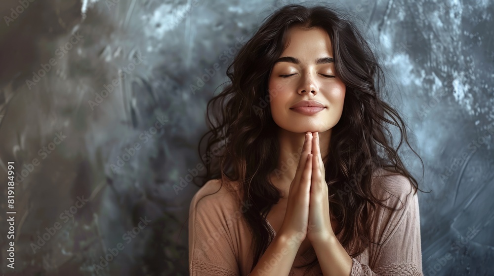 Woman prays with hands in namaste gesture