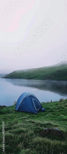 Lakeside Retreat Blue Tent Amidst Foggy Serenity