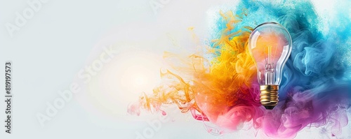 Creative concept of colorful explosion from light bulb, bright idea or inspiration and innovation with copy space for text on grey background.