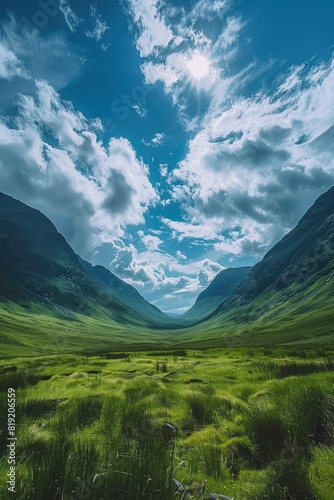 Majestic Scottish Highlands A Serene Green Valley under a Blue Sky © MEHDI