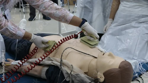 Emergency and first aid class on cpr doll, Cardiac life support photo