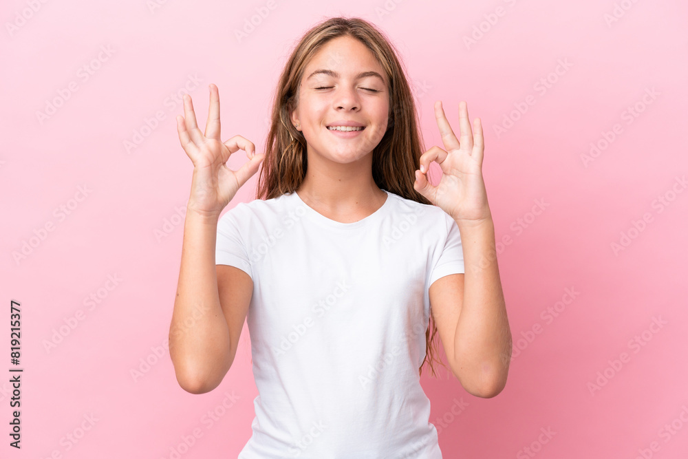 Little caucasian girl isolated on pink background in zen pose Little caucasian girl isolated on pink background in zen pose
