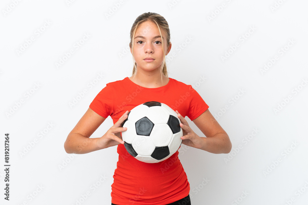 Little caucasian girl isolated on white background with soccer ball