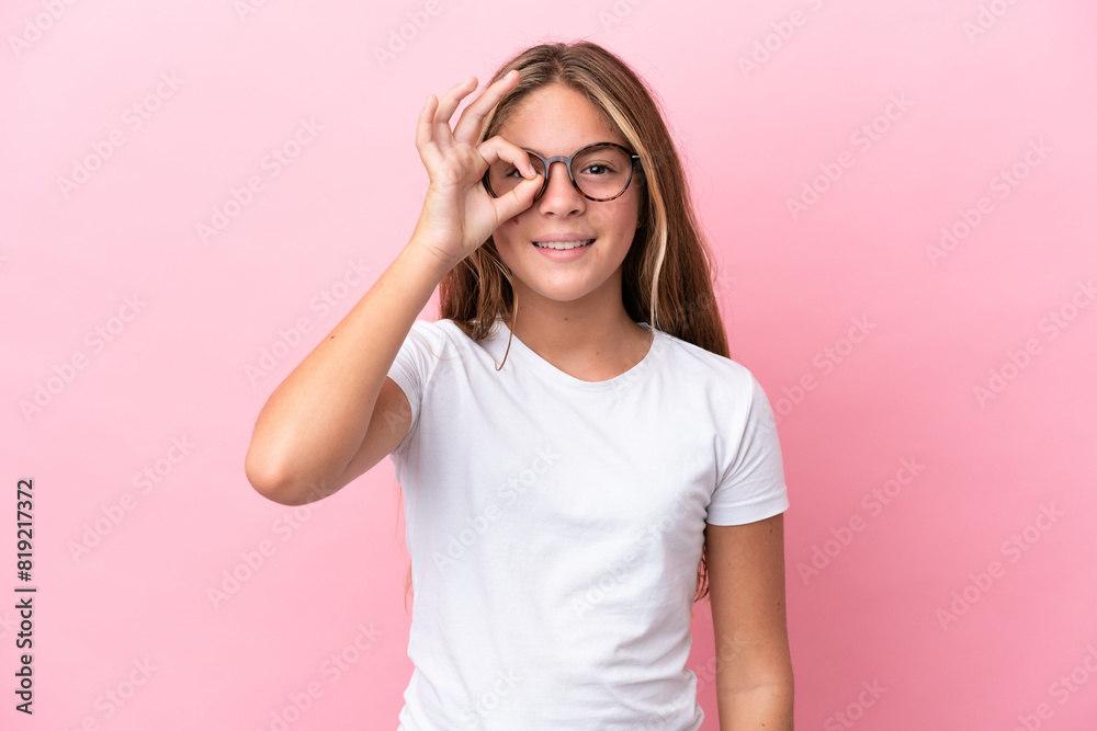 Little caucasian girl isolated on pink background With glasses with happy expression Little caucasian girl isolated on pink background With glasses with happy expression