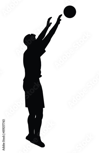 Black silhouette of a man jumping and pushing a volleyball with two hands