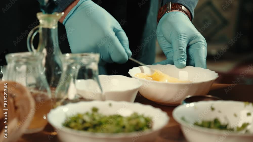 Cooking dough in the kitchen. Cooking. The chef beats the eggs in a bowl with a whisk Cooking dough in the kitchen. Cooking. The chef beats the eggs in a bowl with a whisk