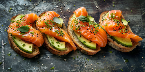 Open sandwich with smoked and salted salmon for healthy breakfast, Trout and avocado on bruschetta 