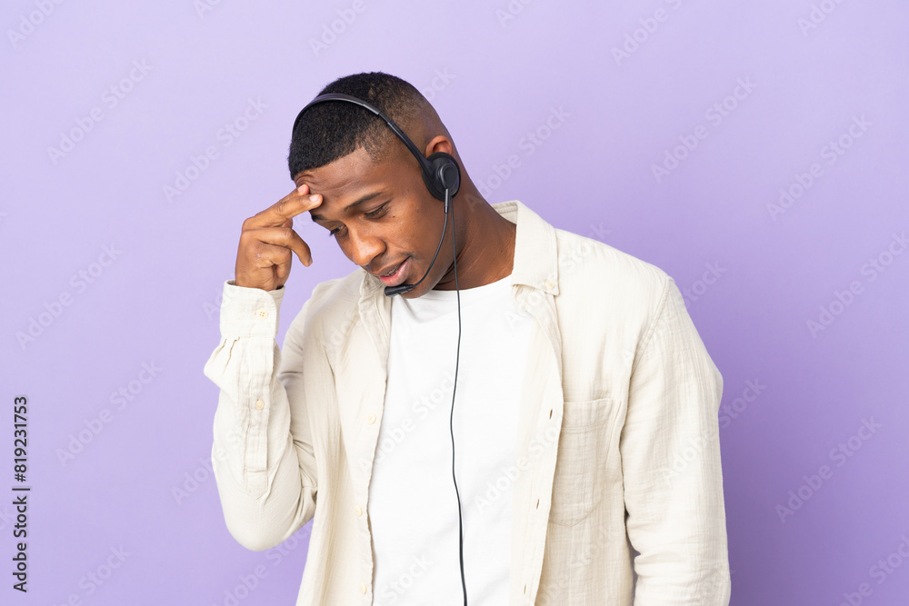 Telemarketer latin man working with a headset isolated on purple background laughing Telemarketer latin man working with a headset isolated on purple background laughing