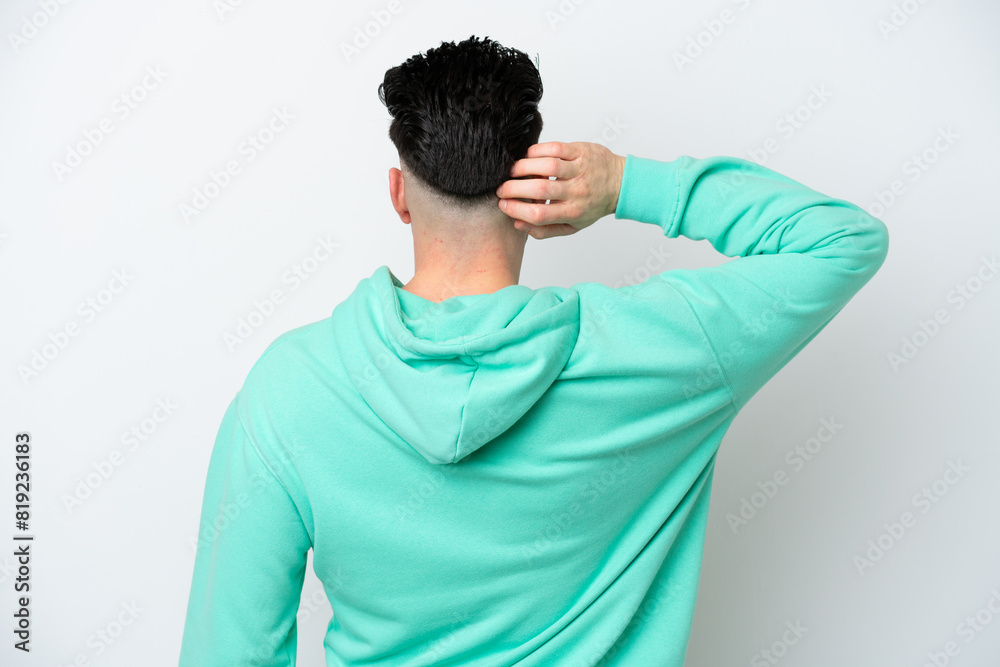 Young caucasian man isolated on white background in back position and thinking Young caucasian man isolated on white background in back position and thinking
