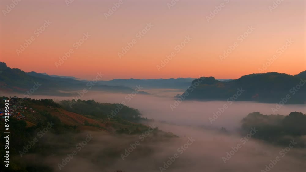 Sunrise landscape with mountains and valley blanketed in fog, showcasing natural tranquility and beauty in morning. Scenic view of foggy hills at dawn with warm light illuminating horizon. Sunrise landscape with mountains and valley blanketed in fog, showcasing natural tranquility and beauty in morning. Scenic view of foggy hills at dawn with warm light illuminating horizon.