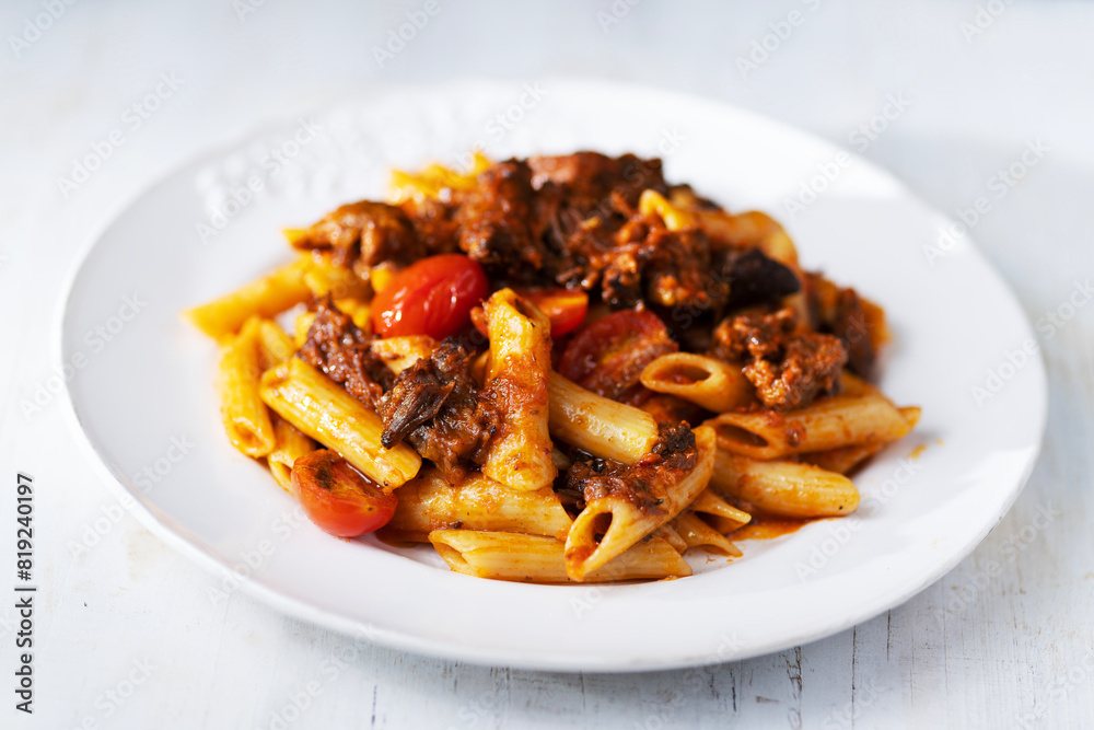 italian penne pasta in oxtail bolognese sauce italian penne pasta in oxtail bolognese sauce