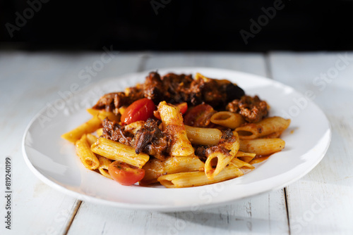 Obraz na płótnie italian penne pasta in oxtail bolognese sauce w salonie