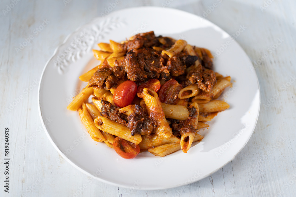 italian penne pasta in oxtail bolognese sauce italian penne pasta in oxtail bolognese sauce