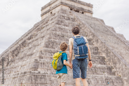 Father and son tourists observing the old pyramid and temple of the castle of the Mayan architecture known as Chichen Itza these are the ruins of this ancient pre-columbian civilization and part of