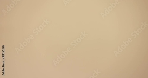 female hand on a beige background, open palm
