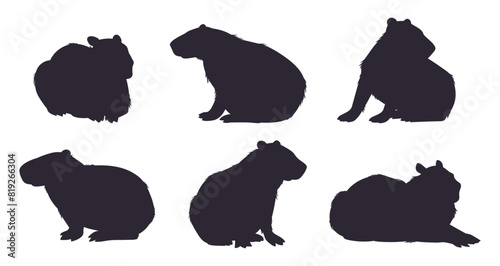 Wild capybara silhouettes. Cartoon cute capybara mammals stencil flat vector illustration set. Semi-aquatic capybara animals silhouette collection © GreenSkyStudio