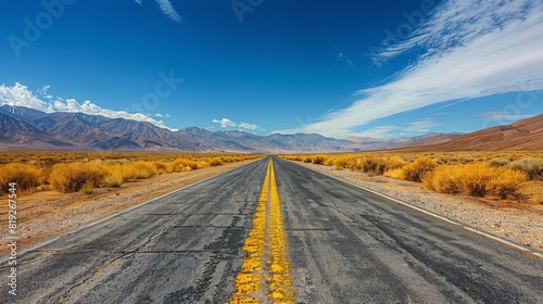 Empty Road in Desert With Mountains Background
