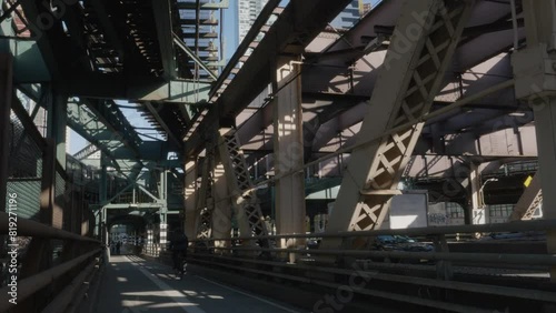 The subway passes directly above The Queensboro Bridge bike path photo