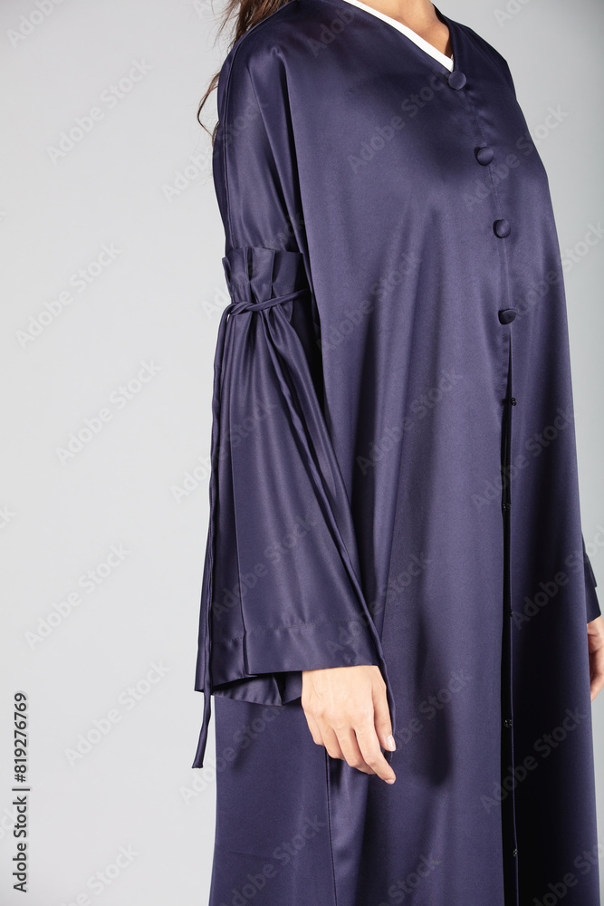 an Arab lady graces the scene in a traditional Arabic abaya an Arab lady graces the scene in a traditional Arabic abaya